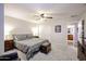 Comfortable bedroom featuring a bed, ceiling fan, closet, and access to the ensuite bath at 22927 N 41St St, Phoenix, AZ 85050