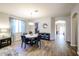 Open dining room area with wood floors, round table and chairs, and lots of natural light at 22927 N 41St St, Phoenix, AZ 85050
