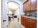 Kitchen features wood cabinets, granite countertops, and tiled backsplash at 22927 N 41St St, Phoenix, AZ 85050