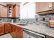 The kitchen sink features a stainless steel dishwasher and granite countertops at 22927 N 41St St, Phoenix, AZ 85050