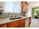 Kitchen sink with stainless steel dishwasher, granite countertops, and tile backsplash at 22927 N 41St St, Phoenix, AZ 85050