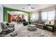 Open floor plan with kitchen and living room with plush furniture and bright natural light at 22927 N 41St St, Phoenix, AZ 85050