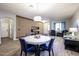 Open floorplan from dining to living spaces with wood floors and modern design at 22927 N 41St St, Phoenix, AZ 85050