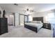 Relaxing main bedroom featuring a ceiling fan and ensuite bathroom with sliding door entry at 22927 N 41St St, Phoenix, AZ 85050