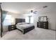 Comfortable primary bedroom with a ceiling fan and a matching dresser and nightstands at 22927 N 41St St, Phoenix, AZ 85050