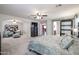 This primary bedroom flows to a sitting room and boasts an ensuite bathroom at 22927 N 41St St, Phoenix, AZ 85050
