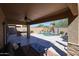Stunning backyard patio with a pool, outdoor bar, and comfortable lounge area for entertaining at 22927 N 41St St, Phoenix, AZ 85050