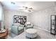 Comfortable sitting room with patterned wallpaper and plush chairs, perfect for relaxing at 22927 N 41St St, Phoenix, AZ 85050