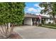 Classic home featuring a covered carport, well-kept landscaping, and inviting curb appeal at 26 W Rawhide Ave, Gilbert, AZ 85233