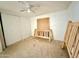 Bedroom featuring a ceiling fan, white walls and closet, and an unfinished wood frame bed at 2650 W Union Hills Dr # 346, Phoenix, AZ 85027