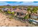Aerial view of backyard with desert landscaping, covered patio, pool and desert mountain views at 29412 N 128Th Ln, Peoria, AZ 85383