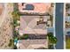 Aerial view of a home in a desert community with tile roofs, desert landscaping and a refreshing swimming pool at 29412 N 128Th Ln, Peoria, AZ 85383