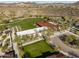 Community amenities including a lawn, clubhouse, tennis court, and parking, all nestled in the desert at 29412 N 128Th Ln, Peoria, AZ 85383
