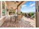 Outdoor patio featuring covered space, pavers, fan, lounge chairs and views at 29412 N 128Th Ln, Peoria, AZ 85383