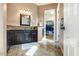 Bathroom features a vanity with marble countertops and a walk-in closet at 29412 N 128Th Ln, Peoria, AZ 85383