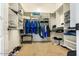 Walk-in closet with ample shelving, hanging space, and carpet flooring at 29412 N 128Th Ln, Peoria, AZ 85383