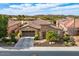 Charming home featuring a tile roof, two car garage, desert landscaping and mountain views at 29412 N 128Th Ln, Peoria, AZ 85383