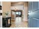 Welcoming foyer flows into a spacious living area with tile flooring and a view of the backyard at 29412 N 128Th Ln, Peoria, AZ 85383
