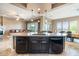 Open-concept kitchen with granite countertops and stainless steel appliances at 29412 N 128Th Ln, Peoria, AZ 85383