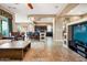 Open-concept living space with a kitchen, dining area, and comfortable seating, perfect for entertaining at 29412 N 128Th Ln, Peoria, AZ 85383