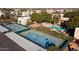 Aerial view showcasing tennis courts, pool, and community landscaping at 3031 N Civic Center Plz # 261, Scottsdale, AZ 85251