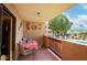 Relaxing balcony with outdoor dining area overlooking the beautiful community pool and landscaping at 3031 N Civic Center Plz # 261, Scottsdale, AZ 85251