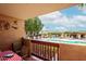 Charming balcony with dining table overlooking pool and palm trees offers a relaxing outdoor space at 3031 N Civic Center Plz # 261, Scottsdale, AZ 85251