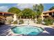 Inviting community hot tub surrounded by lush greenery, offering a relaxing spa-like experience at 3031 N Civic Center Plz # 261, Scottsdale, AZ 85251