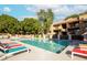 Beautiful community pool area surrounded by lush landscaping, offering a refreshing escape at 3031 N Civic Center Plz # 261, Scottsdale, AZ 85251