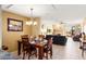 Dining room with a wood table, chandelier and a view of the living room with a fireplace at 3031 N Civic Center Plz # 261, Scottsdale, AZ 85251
