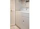 Clean, white, stacked washer and dryer, with tile flooring at 3031 N Civic Center Plz # 261, Scottsdale, AZ 85251