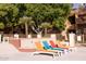 Comfortable poolside lounge seating is available near the community fountain and mature landscaping at 3031 N Civic Center Plz # 261, Scottsdale, AZ 85251