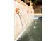 Close-up of water feature wall with running water flowing into pool at 3031 N Civic Center Plz # 261, Scottsdale, AZ 85251