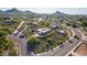Aerial view of a desert landscape with various homes and winding roads at 3101 E Acoma Dr, Phoenix, AZ 85032