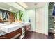 Modern bathroom with double vanity sinks, a large mirror, and ample storage space at 3101 E Acoma Dr, Phoenix, AZ 85032