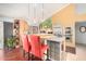 Well-lit kitchen with stainless steel appliances, wooden cabinets, and comfortable seating at the island at 3101 E Acoma Dr, Phoenix, AZ 85032