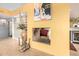 View from living area of architectural fireplace and wall cut-out connecting it to adjacent areas at 3101 E Acoma Dr, Phoenix, AZ 85032