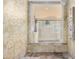 Walk-in shower featuring decorative tile and stone accents, rainfall shower head, and multiple body jets at 3101 E Acoma Dr, Phoenix, AZ 85032
