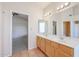 Bright bathroom featuring double sinks and terracotta tile flooring at 3325 N 116Th Dr, Avondale, AZ 85392