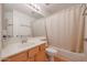 Bathroom with a single sink vanity, a shower-tub combo and tile flooring at 3325 N 116Th Dr, Avondale, AZ 85392