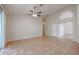 Spacious living area featuring tile flooring, high ceilings, and an open layout design at 3325 N 116Th Dr, Avondale, AZ 85392