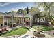 Charming backyard featuring a pergola-covered patio, water fountain feature and lush landscaping at 34 W Vernon Ave, Phoenix, AZ 85003