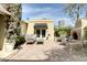 Inviting backyard area with cozy seating, outdoor fireplace, brick patio, and lush greenery for relaxation at 34 W Vernon Ave, Phoenix, AZ 85003