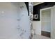 Shower with white subway tile and black and white curtains and a tiled floor at 34 W Vernon Ave, Phoenix, AZ 85003