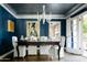 Elegant dining room with designer lighting and direct access to the outdoor patio and backyard at 34 W Vernon Ave, Phoenix, AZ 85003