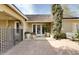 Charming home exterior featuring a brick patio, manicured landscaping, and stylish outdoor decor and potted flowers at 34 W Vernon Ave, Phoenix, AZ 85003