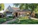 Charming vintage home with manicured front yard and brick pathway leading to the welcoming front entrance at 34 W Vernon Ave, Phoenix, AZ 85003
