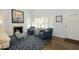 Comfortable living space with fireplace, hardwood floors, and charming decor for relaxing or entertaining at 34 W Vernon Ave, Phoenix, AZ 85003