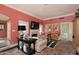 Spacious living room with fireplace, comfortable seating, brick floor, and access to the backyard at 34 W Vernon Ave, Phoenix, AZ 85003