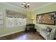 Bright home office with a large window, hardwood floors, and comfortable chair and desk at 34 W Vernon Ave, Phoenix, AZ 85003
